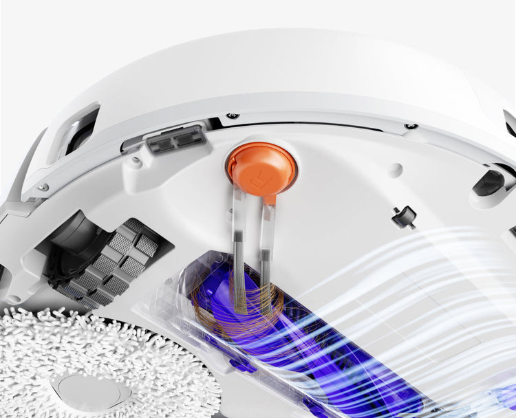 Close-up of Narwal Freo Pro robot vacuum and mop roller brush removing tangled hair with strong airflow design.