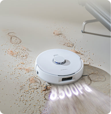 Narwal Freo Pro robot vacuum and mop using 8,500Pa suction to lift dirt, crumbs, and hair from hard floors.